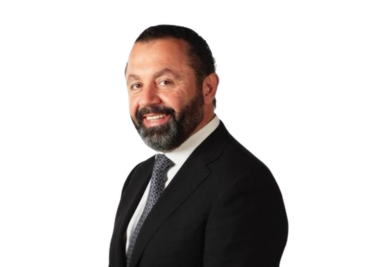 Belal smiling in black suite
